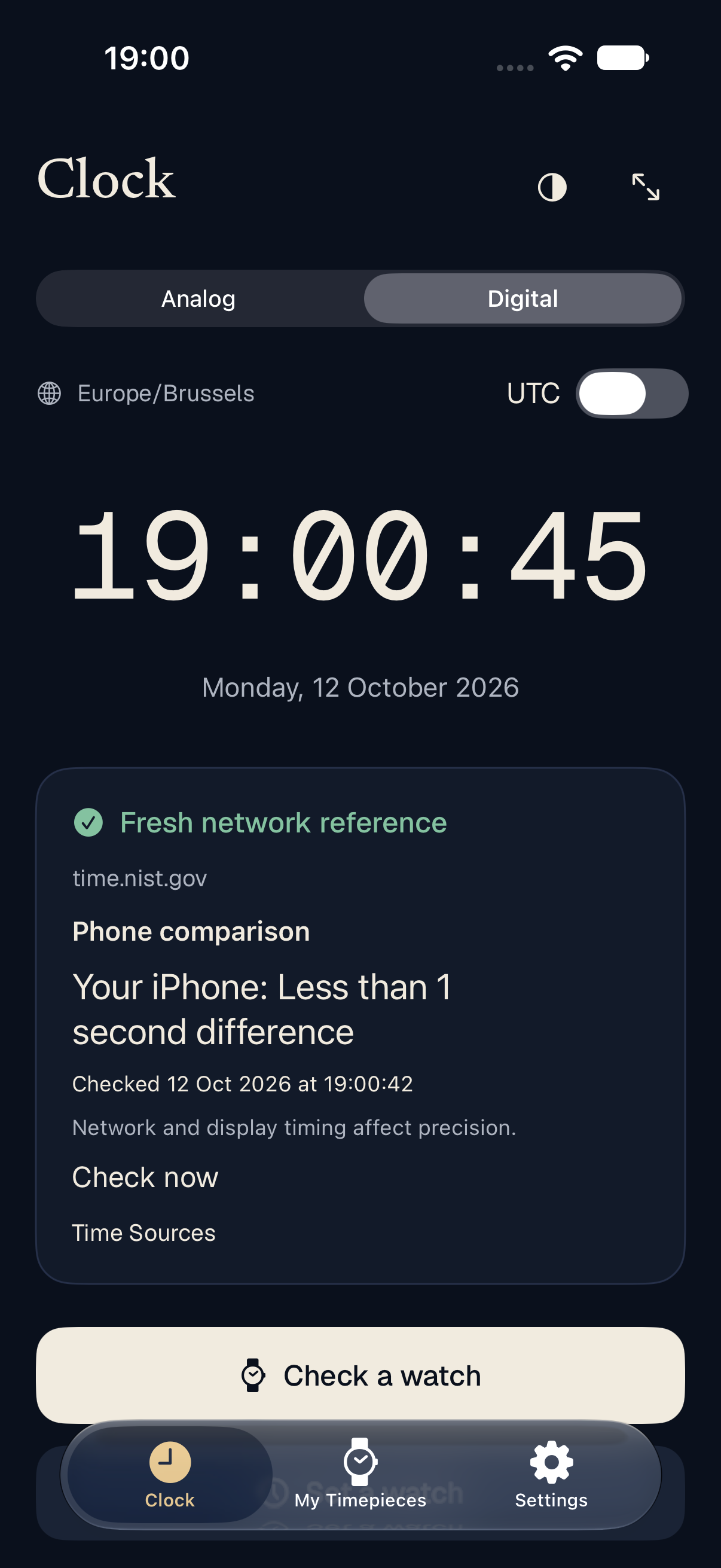 The digital reference clock in dark appearance with analog and digital face controls.